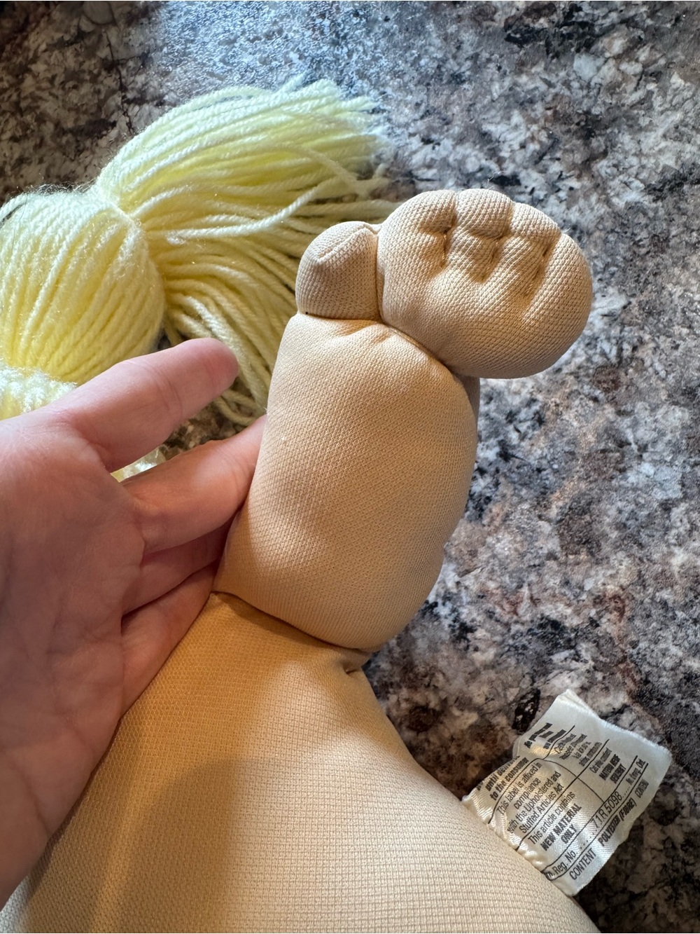 A Cabbage Patch Kid doll with blonde yarn hair and a purple dress - Picture 6 of 11